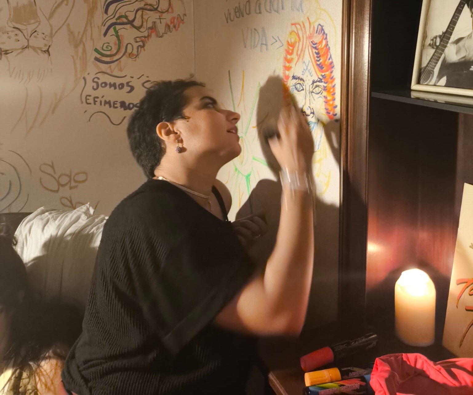 Zainab painting a mural